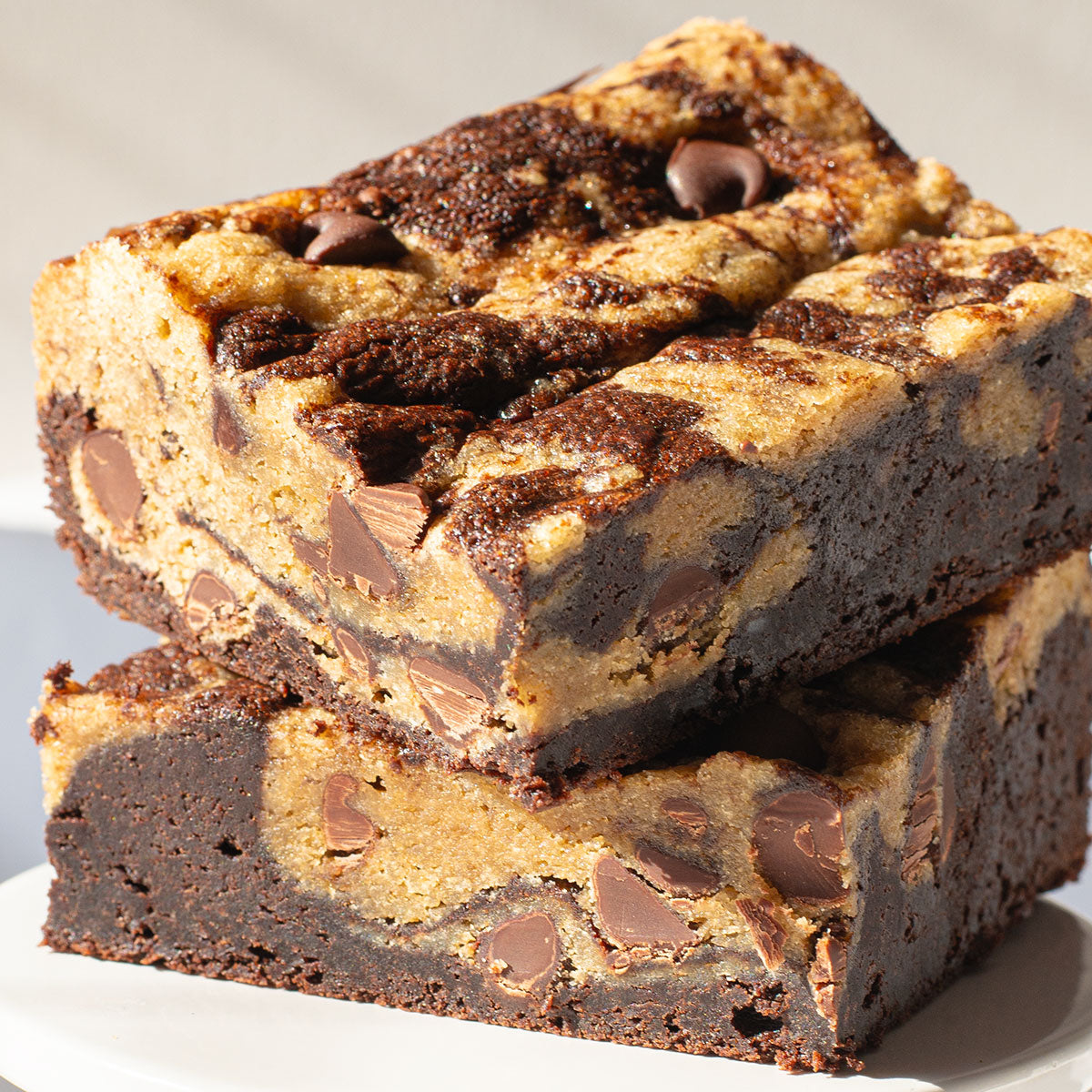 A mouthwatering image of Brookies, showcasing the perfect fusion of chocolate chip cookie dough and fudgy brownie dough in a single bar, delivering the best of both worlds.