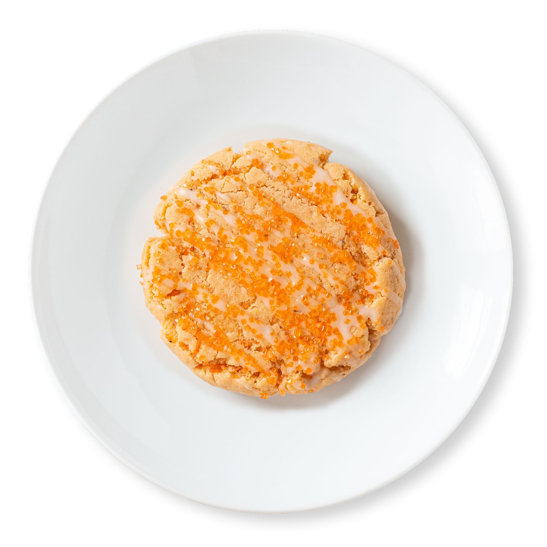 A close-up image of a Mimosa Cookie with champagne glaze and orange sanding sugar.