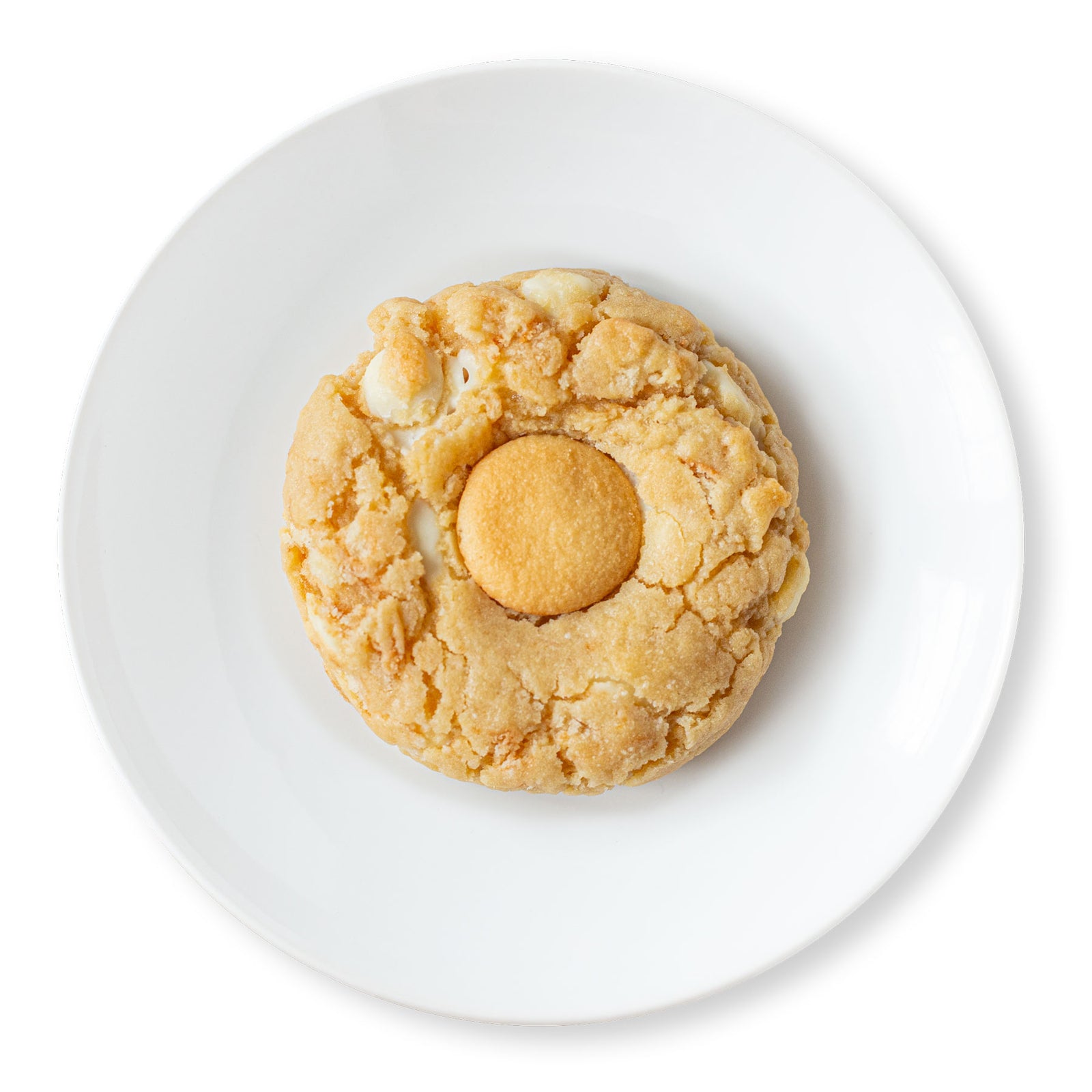 A close-up image of a banana pudding cookie topped with a Nilla Wafer