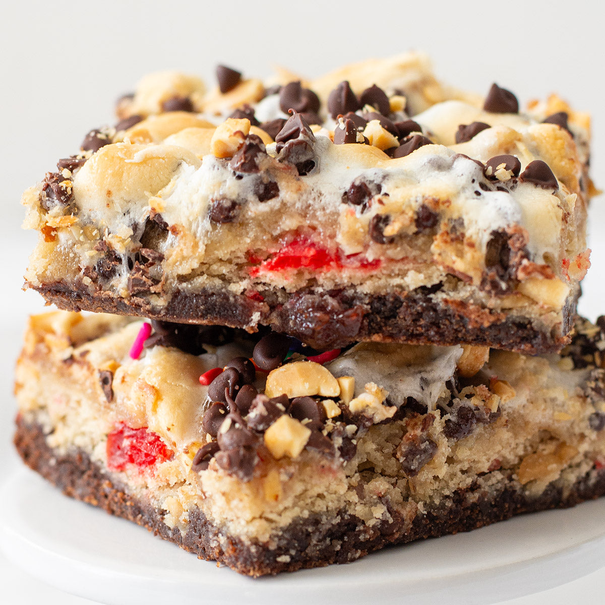 A colorful and delicious Banana Split Brownie viewed from above, featuring layers of fudgy brownie, banana bar, and assorted toppings, evoking summertime sweetness in every bite.