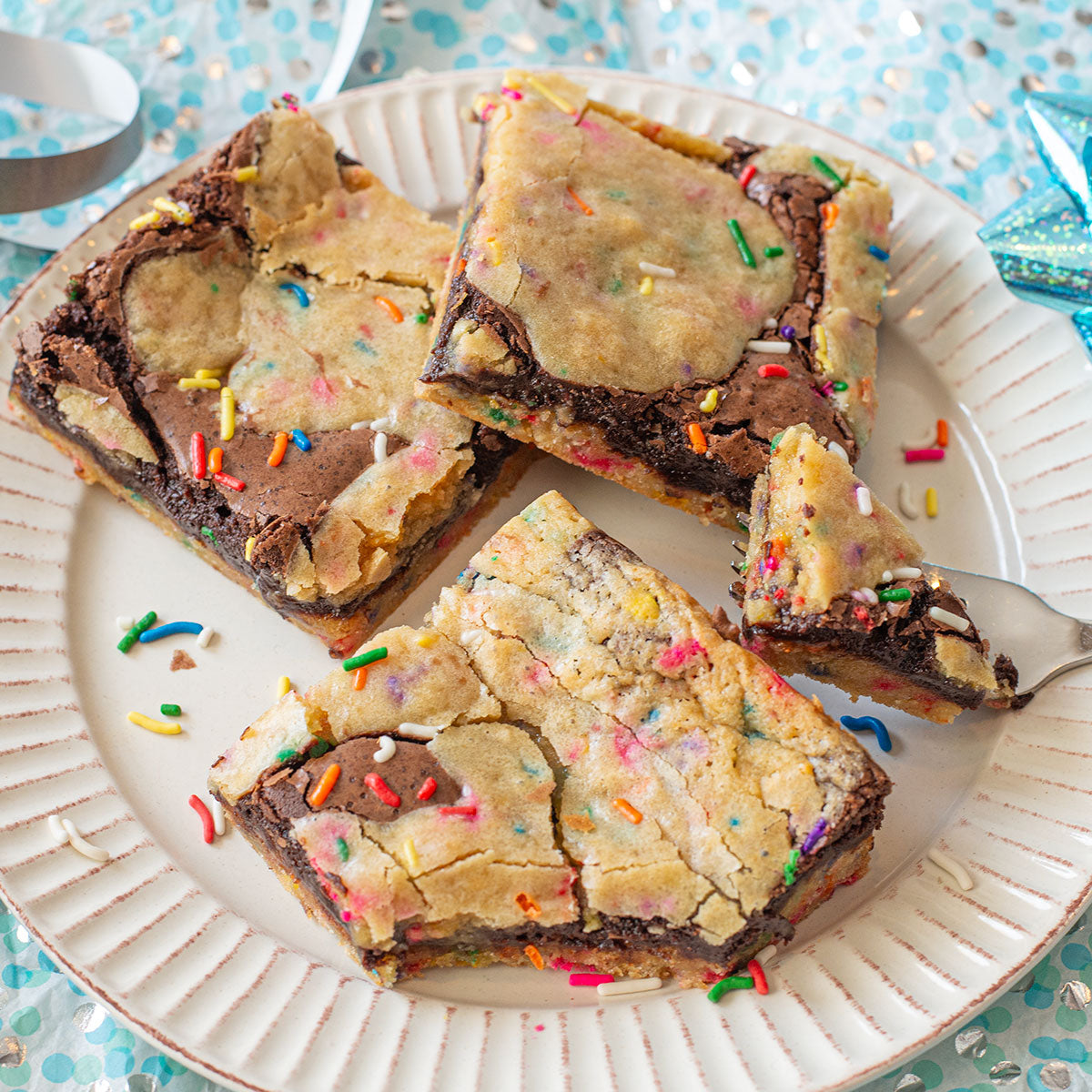 A celebratory image of a Birthday Cake Brownie, capturing the delightful combination of fudgy brownie and sweet, cake-like cookie dough in one delicious bar.