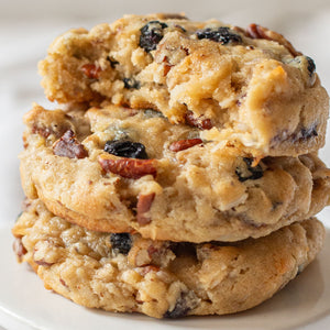 Stack of delicious blueberry coconut pecan cookies with chewy coconut, crunchy pecans, and sweet dried blueberries