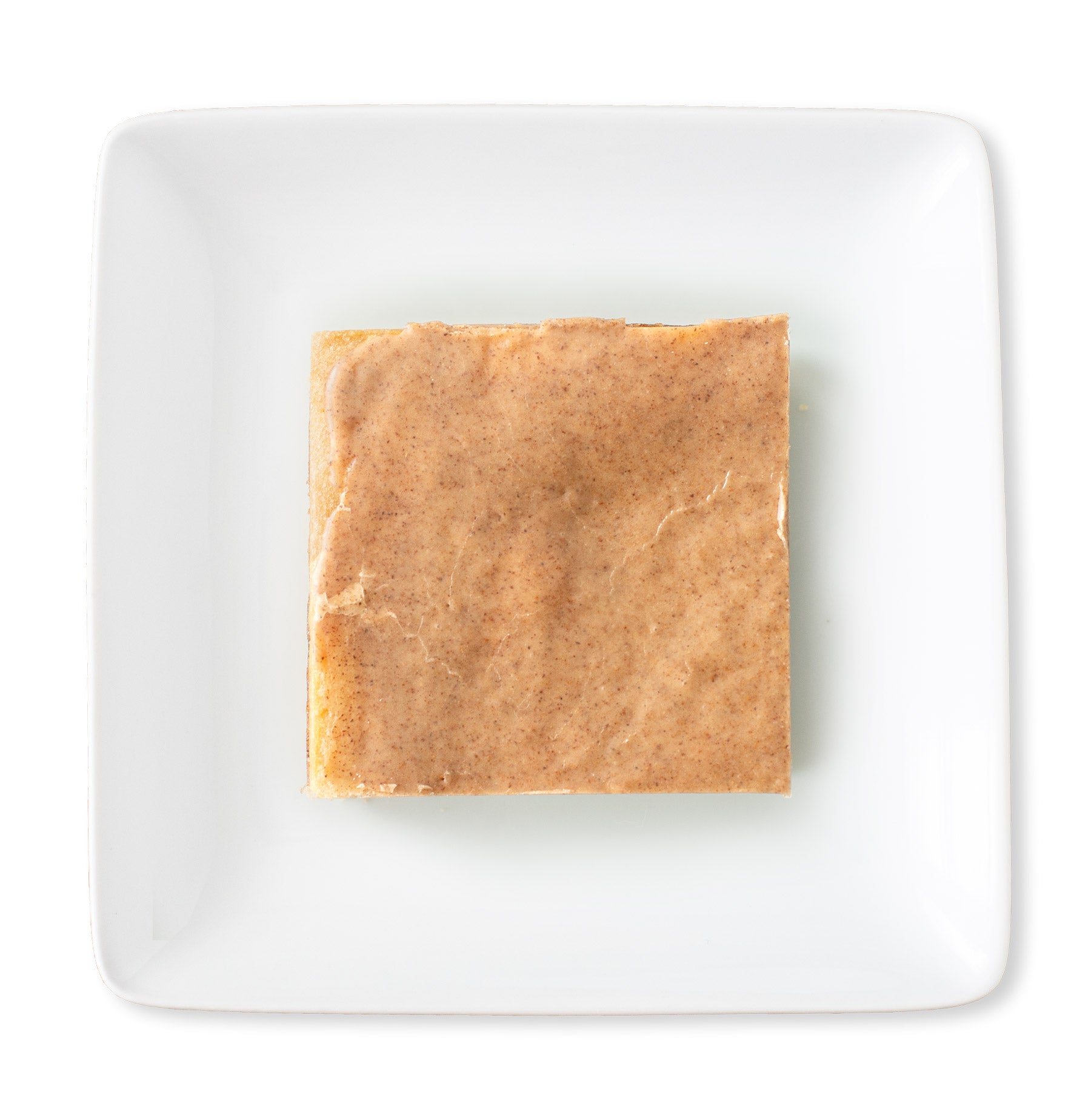 A delectable Brown Sugar & Spice Delight Bar from above—golden layers with a cinnamon glaze, all set to be enjoyed.