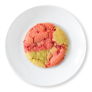 Overhead shot of a Cherry Limeade Cookie showcasing its beautiful swirled pattern of cherry and lime dough.