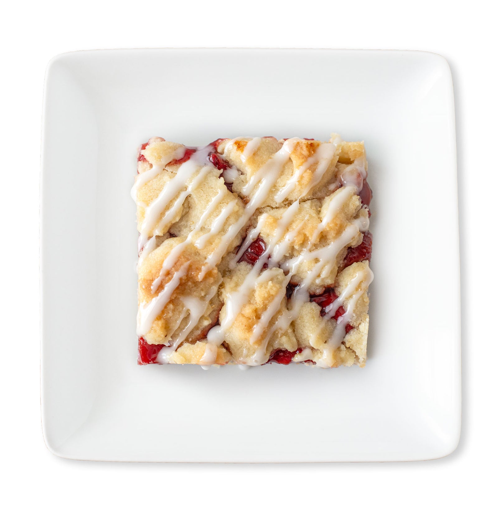 Overhead shot of a cherry pie bar on a plate, showing layers of golden shortbread crust, vibrant cherry filling, crumb topping, and a light almond glaze drizzle.