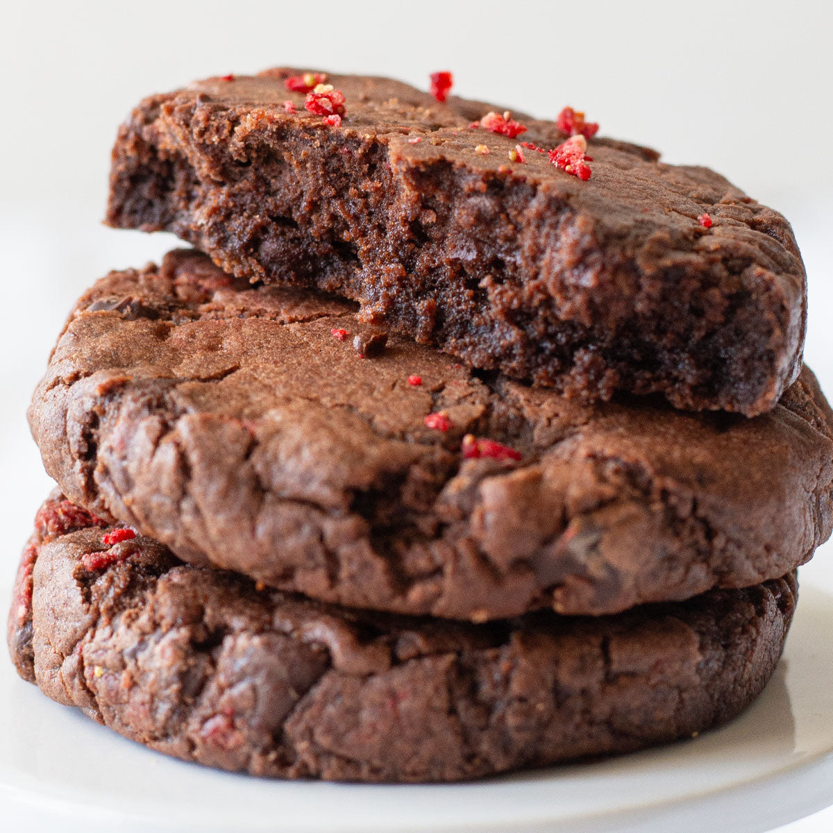 Homemade Chocolate Strawberry Cookies with chocolate chips on a plate.