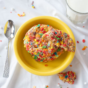An assortment of tempting Fruity Fusion Cookies, capturing their vibrant and nostalgic essence with cereal milk dough, fruity cereal pieces, mini marshmallow bits, and a final touch of cereal coating, providing a joyful and delicious experience.