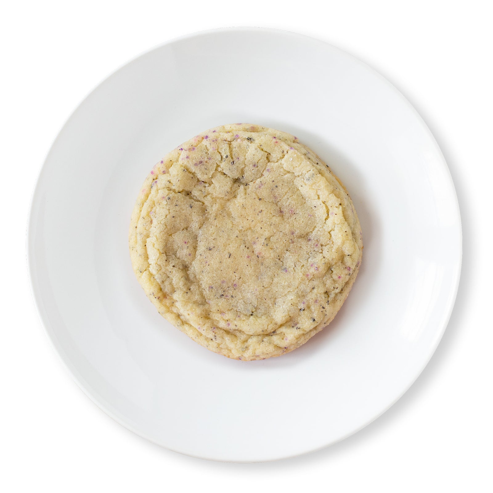 Overhead view of a Lavender Earl Grey cookie from Cravings Baked Goods, a chewy buttery sugar cookie infused with Earl Grey tea and lavender flavor, rolled in sugar.