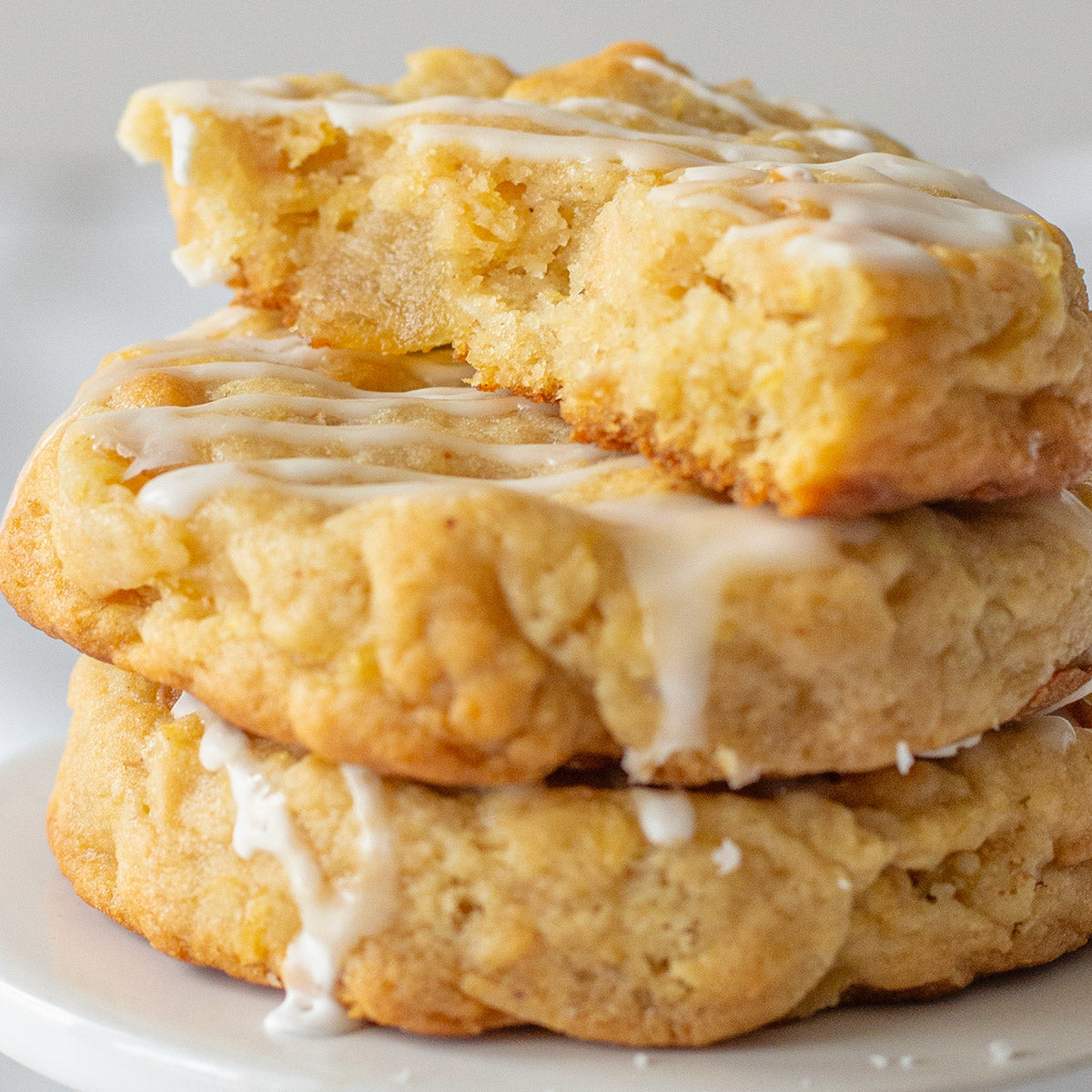 Pineapple coconut cookie with toasted coconut and pineapple chunks, topped with pineapple glaze.